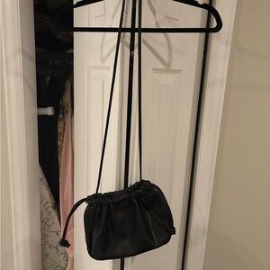 Minimalist Black Drawstring Crossbody Bag for Women never been worn